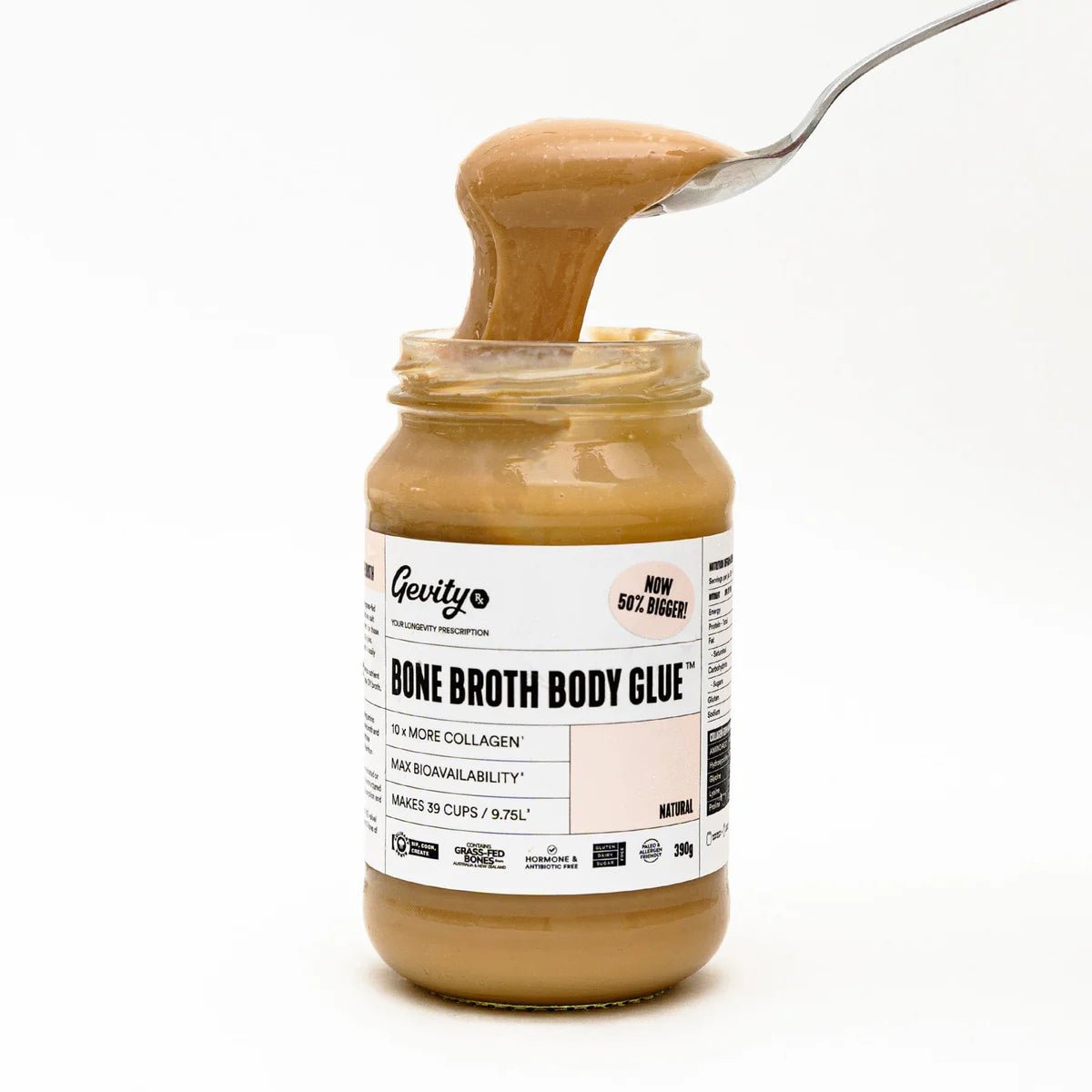 Jar of Bone Broth Body Glue - Natural - 390g by Gevity Rx with spoon lifting thick broth against white background