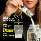 Person pouring LMNT Lemonade Salt Electrolyte Mix - 30 Sticks by LMNT into water bottle with instructions for mixing different salt intensities for keto hydration.
