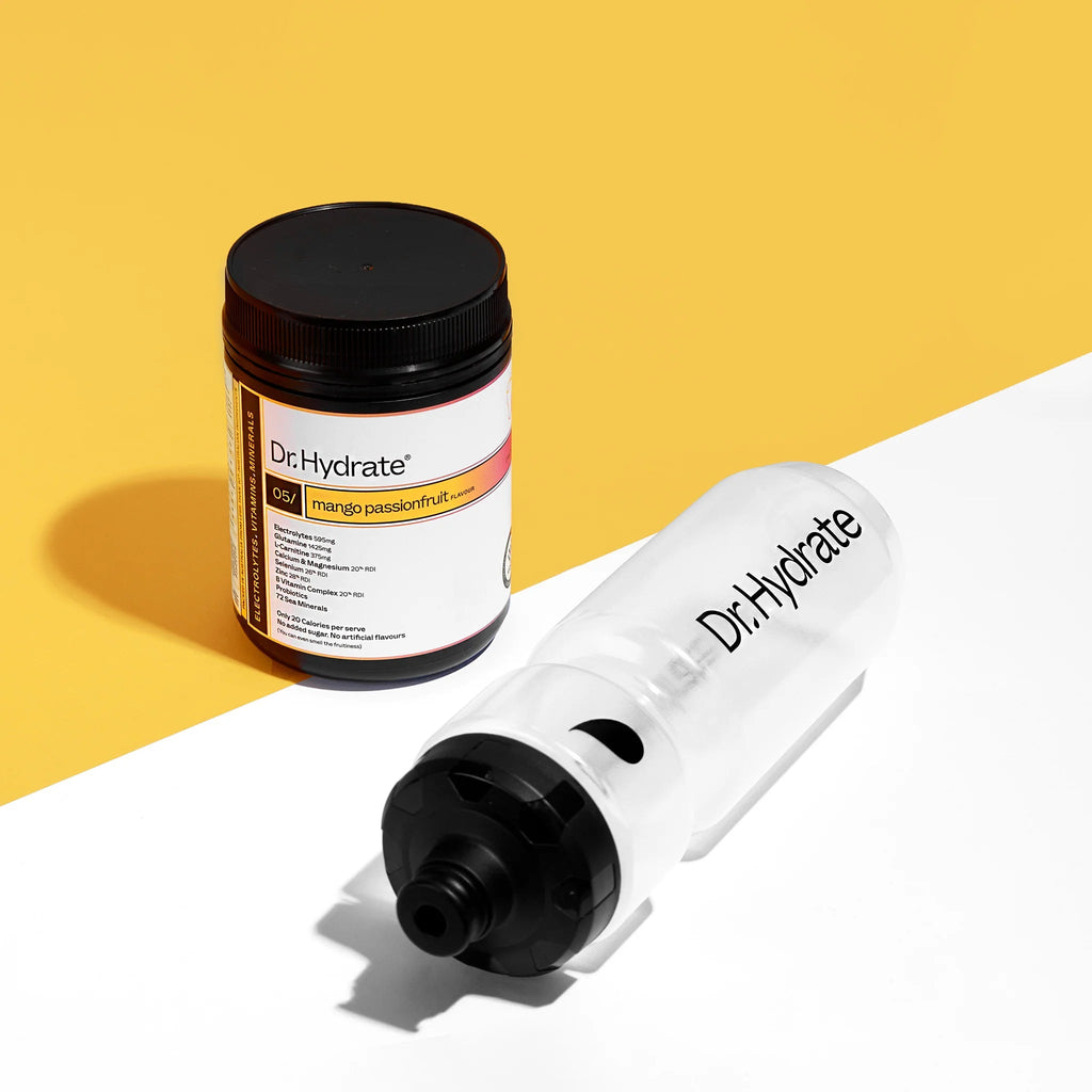 Mango Passionfruit Jar - 30 Serves by Dr. Hydrate with clear Dr. Hydrate water bottle on yellow and white background